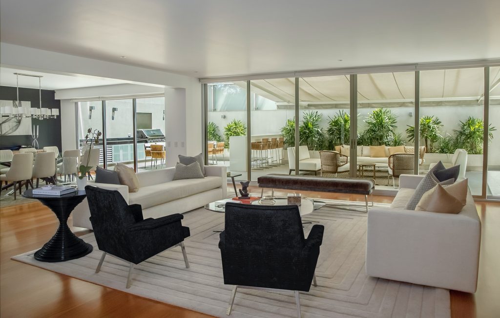 Spacious and bright living area with inviting glass sliding doors, creating a seamless indoor-outdoor living experience.