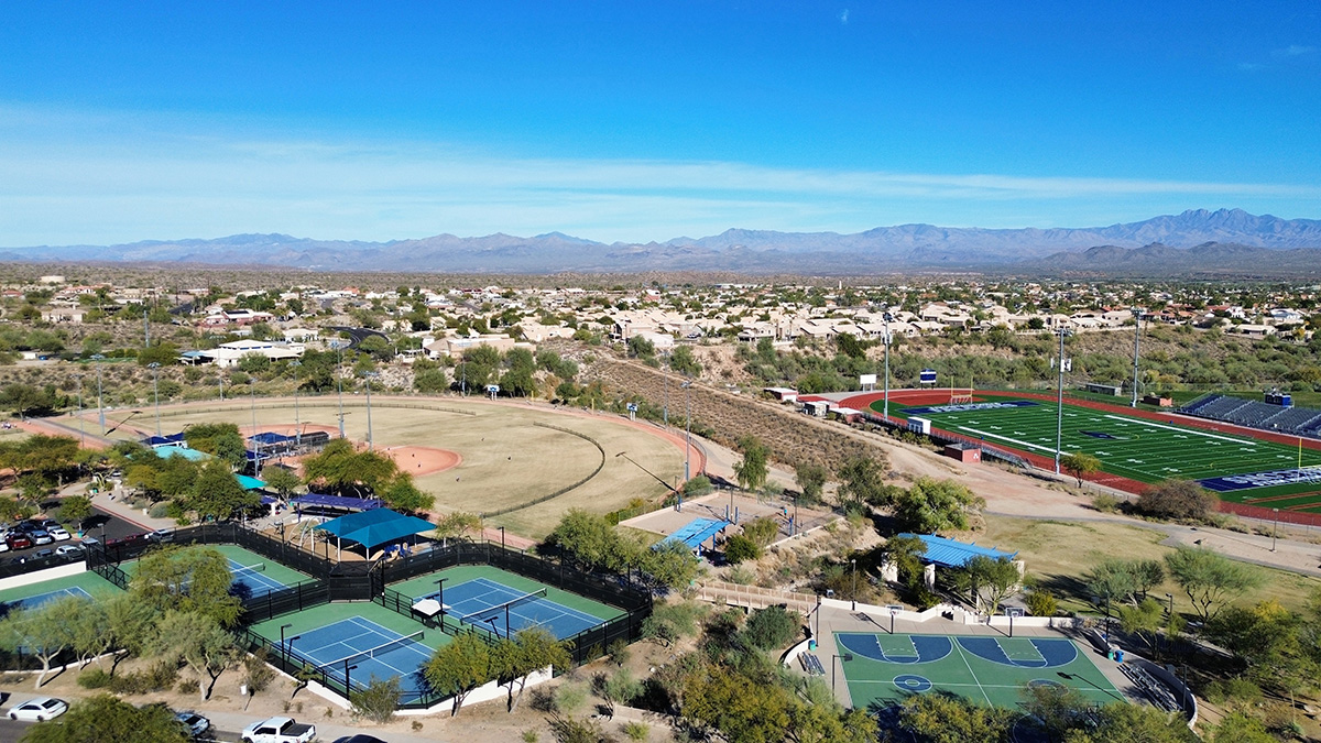 Aerial view of Golden Eagle Park in Fountain Hills, showcasing the vibrant playgrounds, sports fields, walking trails, and the scenic desert landscape